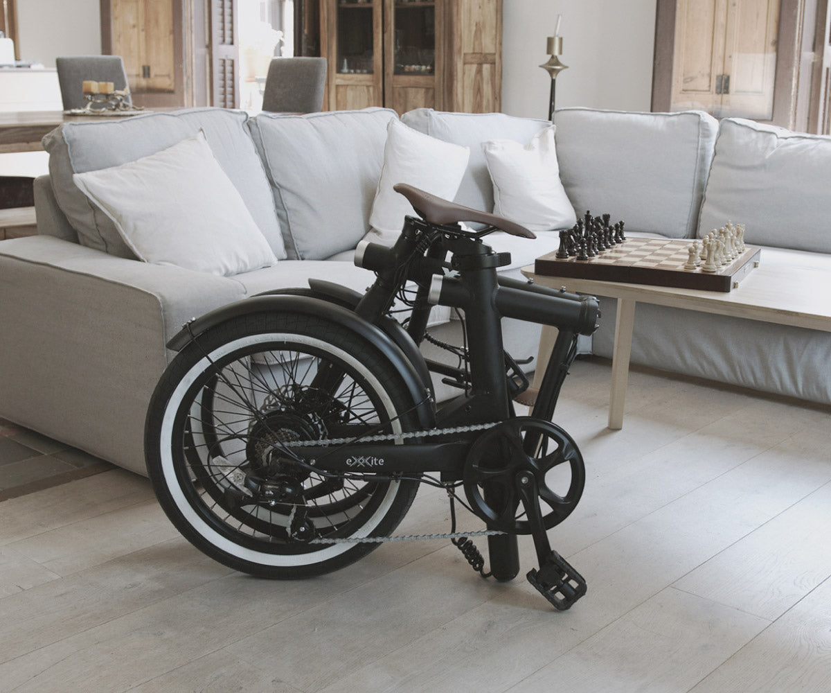 Exxite XS folding electric bicycle, folded in an apartment